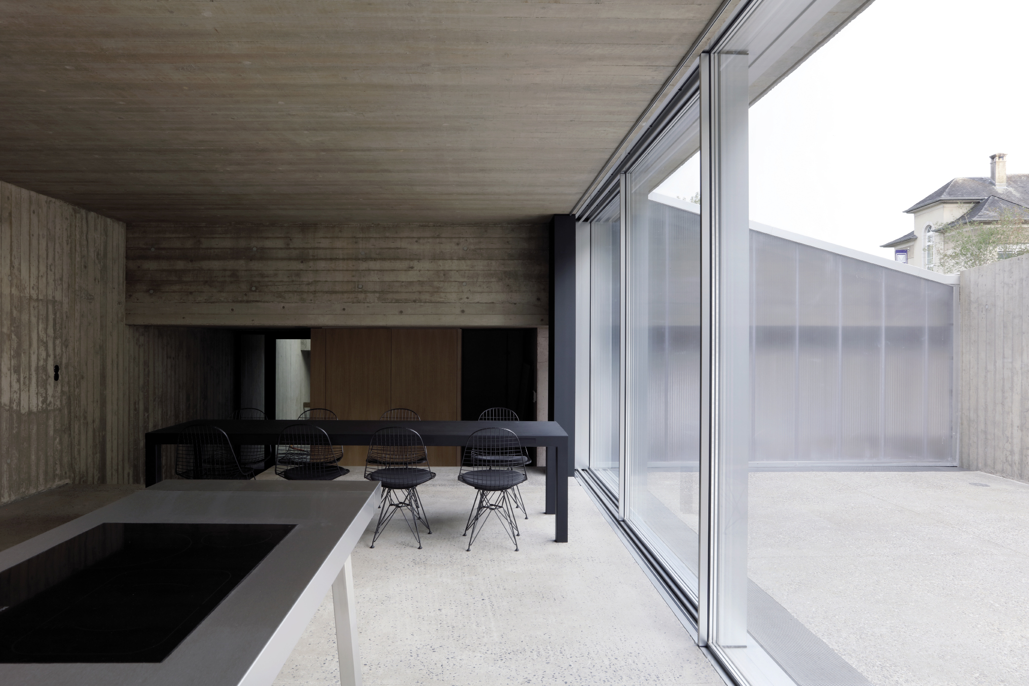 view from dressing into patio / street facade and context 2001 S.à R.L.
